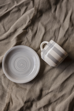 Taza de té con plato