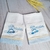 Conjunto de duas fraldas de boca personalizadas com bordado de ursinho aviador e nome "Nicolas".