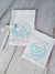 Kit de batizado com toalha de linho personalizada, fralda de boca bordada e vela decorativa.