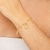 PULSEIRA MISTÉRIO GOZOSO DOURADA na internet