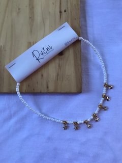 collar 7 estrellas dorado y blanco