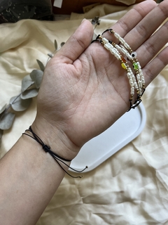 Pulsera de perla ojito marron en internet
