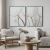 Composição de dois quadros decorativos com imagens de flores de dente de leão em um ambiente moderno e aconchegante.