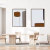 Dois quadros decorativos com linhas e formas abstratas em um ambiente moderno.