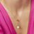 Colar com cristais ovais na cor rosa, zircônias cravejadas, pérola Shell e banho de ouro 18k. Ana Tereza Semijoias.