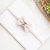 Laço de linho bordado cerejinha rosa/RN - comprar online