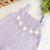 Jardineira tricot lilás bordada - comprar online