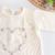 Macacão tricot amarelo - coração de flores na internet