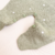Macacão tricot verde poá branco na internet