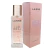Perfume feminino La Rive I Am Ideal for Woman eau de parfum 90ml com frasco transparente e tampa dourada ao lado da embalagem rosa com detalhes florais
