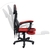 A imagem mostra uma cadeira gamer ergonômica moderna com um esquema de cores preto e vermelho. A cadeira possui apoios de braço ajustáveis, um encosto alto com material de malha respirável e está montada em uma base de estrela de cinco pontas com rodízios
