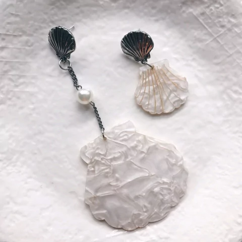 Brinco conchas diferentes