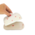 Mantequera Corazones con tapa decorada con pequeños corazones rojos, en manos de una persona.