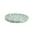 Plato de postre circular con diseño de círculos en color verde claro y fondo blanco.