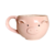 Taza de cerámica en forma de chanchita, color rosa, con detalles en negro.