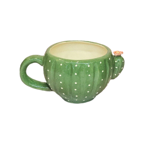 Tazón en forma de cactus verde con detalles en blanco y un pequeño cactus decorativo en el borde.