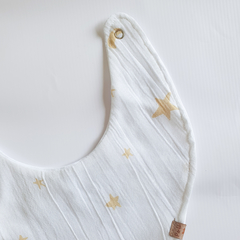 Babero Gasa Estrellas Mostaza en internet