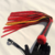 Flogger negro y rojo de cuerina 'Filotes' 20 colas - comprar online