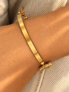 PULSERA VAN CLEEF RIGID BLACK - ACERO DORADO en internet