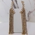 Brinco Ear Cuff de Franjas Dourado e Pedras Prata - Base Dourada