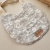 Babero Bibs - Flores beige