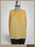 Pullover tipo jersey de color amarillo, con mangas largas, diseño holgado y disponible en talles grandes.