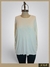 Pullover tipo jersey en color blanco, con mangas largas y un diseño sencillo, diseñado para talles grandes, presentado sobre un maniquí.