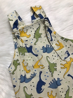 Jardineira Ilhós Dinossauros Bege - comprar online