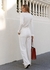 Calça alfaiataria em malha com corte reto, mas cores preta, off white, bege e azul marinho. Com bolsos. Confortável e estilosa. 