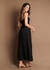 Vestido longo em malha com recortes e detalhe flor no busto. Cores off white, lima e preto. 