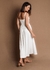 Vestido longo em malha com recortes e detalhe flor no busto. Cores off white, lima e preto. 