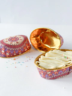 Contenedor ovalado de papel estampado. Precio por unidad.