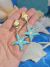 Brinco Estrela Gold com Resina Azul - loja online