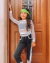 Conjunto Mafê de calça preta, crooped e blusa telinha branca manga longa