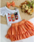 Conjunto de saia laranja e blusa um - comprar online