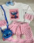 Conjunto de saia pelinho e blusão aplicação stitch (opção de cor)