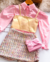 Conjunto de short saia Tweed rosa , camisa e cropped dourado na internet