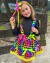 Conjunto de salopete colorida com Neon e blusa preta Carolina (acompanha laço de cabelo)