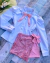 Conjunto de short saia paete rosa e camisa branca laço