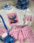 Conjunto de saia pelinho e blusão aplicação stitch (opção de cor)