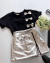 Conjunto de short saia zíper metalizado e blusa preta com laços pratas metalizados - loja online