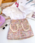 Conjunto de saia tweed e camisa branca manga bufante