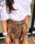Conjunto de saia oncinha com babados e cós de lastex e blusa branca renda manga curta - loja online