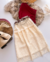 Conjunto de saia renda midi e blusa tule um ombro marsala na internet