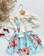 Conjunto de salopete floral azul e blusa off laço Aurora
