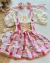 Conjunto de salopete xadrez com vermelho, BLUSA off white e laços de cabelo Olívia - loja online