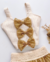 Conjunto de saia midi telinha dourada e cropped laços Isabella na internet