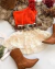 Conjunto de saia renda babados e blusa um ombro laranja flores
