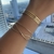 Bracelete Duplo Aro X e Um Aro Reto Banhada a Ouro