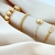 Pulseira Riviera Cristal Com Bola Lisa Banhada a Ouro na internet